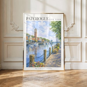 May include: A framed art print titled PATCHOGUE NEW YORK featuring a watercolor-style illustration of a waterfront scene with a clock tower, boats on the water, a wooden boardwalk with chain railings, and colorful flowers under a blue sky.