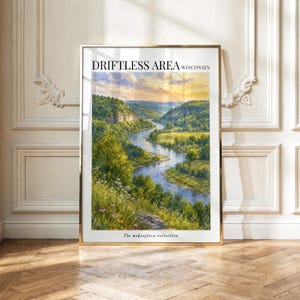 May include: A framed vertical art print titled DRIFTLESS AREA WISCONSIN featuring a landscape painting of a winding river flowing through a lush green valley under a golden sunset sky, with the text The midwestern collection at the bottom.