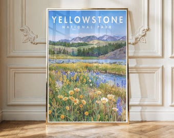May include: A framed art print featuring a landscape of Yellowstone National Park with the text "YELLOWSTONE NATIONAL PARK" at the top. The scene depicts a field of yellow and blue wildflowers in the foreground, a river, green hills, and mountains.