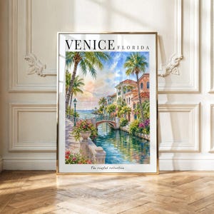 May include: A vertical wall art print titled VENICE FLORIDA featuring a watercolor painting of a canal scene with palm trees, multi-story buildings, a stone bridge, and a lamppost. The text The coastal collection is printed at the bottom.