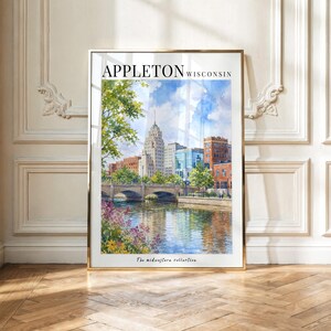 May include: A vertical art print featuring a watercolor cityscape of Appleton, Wisconsin. The scene depicts a stone bridge over a river, surrounded by green trees and colorful flowers in the foreground, with city buildings under a blue sky.