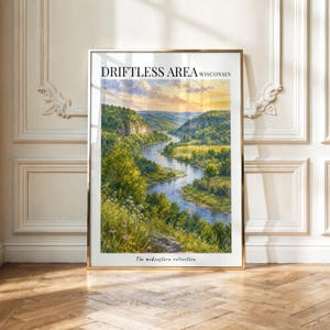 May include: A vertical rectangular wall art print featuring a landscape painting of a winding river through a lush green valley under a golden sunset sky. The text DRIFTLESS AREA WISCONSIN is printed at the top and The midwestern collection at the bottom.