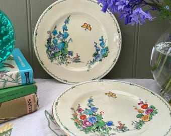 Pair of Staffordshire hand painted hollyhock plates