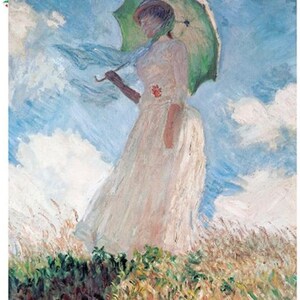 May include: A woman in a white dress holds a green umbrella while walking through a field of tall grass. The sky is blue with white clouds.