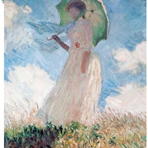 May include: A woman in a white dress holds a green umbrella while walking through a field of tall grass. The sky is blue with white clouds.