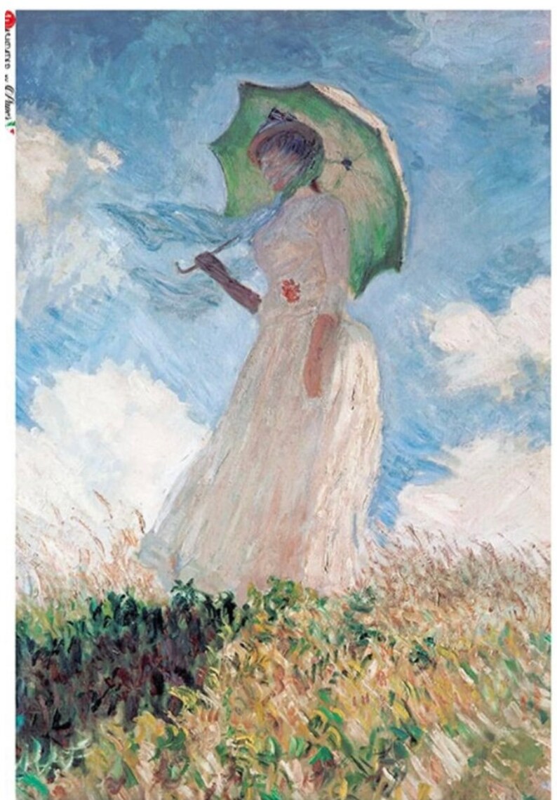 May include: A woman in a white dress holds a green umbrella while walking through a field of tall grass. The sky is blue with white clouds.
