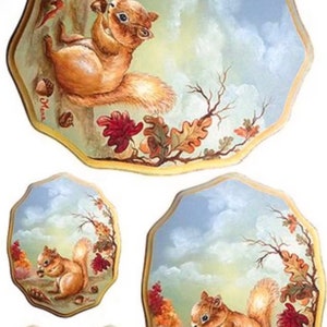 May include: Set of four decorative ceramic plates featuring a squirrel holding an acorn in a woodland setting. The plates are painted with a blue sky, brown branches, and green leaves. The plates are oval shaped with a scalloped edge.