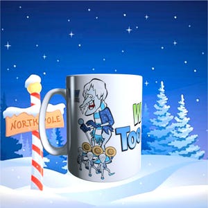 May include: White ceramic mug featuring a cartoon of a frosty character with the text "Winter Too". The mug has a handle and is set against a snowy winter scene with a North Pole sign and evergreen trees.