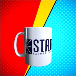 May include: White ceramic mug with the text "STAR LABORATORIES" in navy blue. The mug has a large handle and a graphic design on the side. The background is a split design with red, yellow, and blue colors.