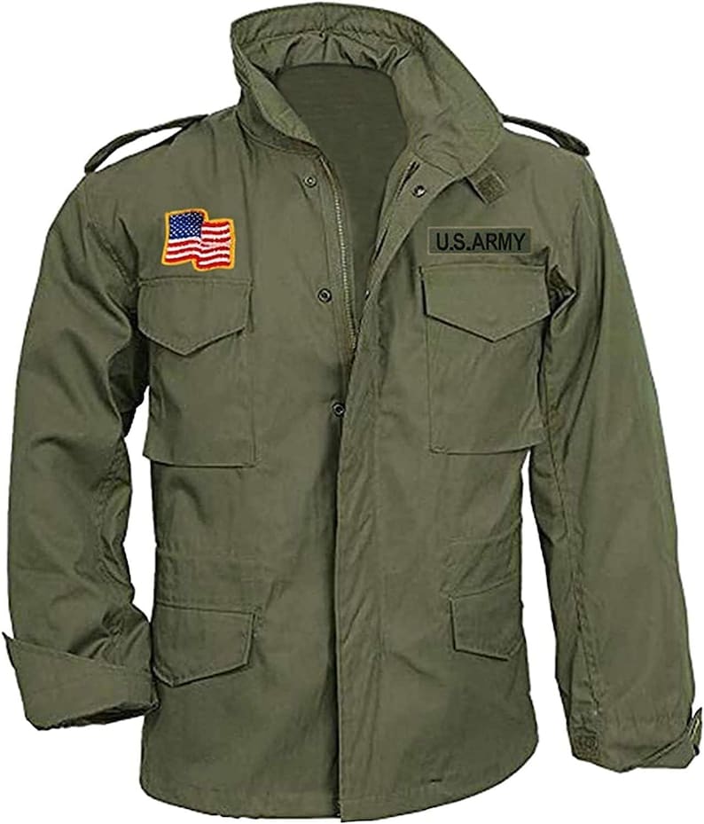 May include: Olive green military-style jacket with multiple pockets and a high collar. Features a U.S. Army patch and an American flag patch on the chest. The jacket has a zipper closure and buttoned cuffs.