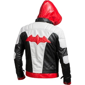 May include: A black, white, and red leather jacket with a red hood. The back of the jacket features a red bat symbol on a white panel. The jacket has black sleeves and a red bottom hem.
