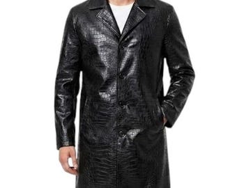 May include: A black, long leather coat with a crocodile skin texture. The coat has a button-up front, a notched collar, and pockets. The person is wearing a white t-shirt underneath the coat.