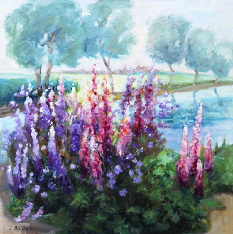 May include: A painting of a field of purple, pink, and white flowers with a blue pond in the background.  There are three trees in the background with a light blue sky.