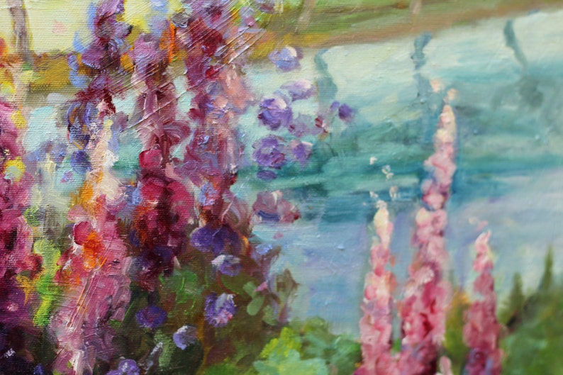 May include: A painting of purple and pink flowers with green leaves in front of a blue and green water background.