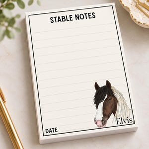 May include: A rectangular notepad with a white background and black border. The top reads STABLE NOTES in black text. Below are horizontal lines for writing. The bottom right features a horse illustration with the name Elvis printed below it.
