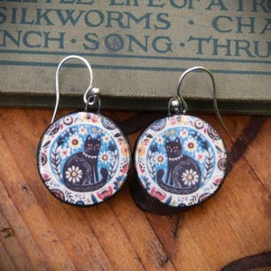 Handmade ceramic black cat earrings, folk art design with sterling silver ear hooks. Handmade in N Yorks.- Cat lover gift