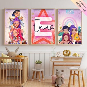 May include: Three framed art prints featuring anime-style illustrations. One print displays three figures stacked on top of each other. Another features the name "Emma" in a stylized font. The third print shows three figures taking a selfie. The prints have a pink and purple color scheme.