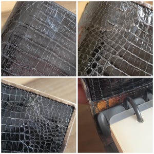 Puede incluir: Primer plano de una cubierta de agenda de cuero negro con un patr&oacute;n de cocodrilo en relieve. La cubierta tiene un ligero brillo y muestra signos de desgaste.