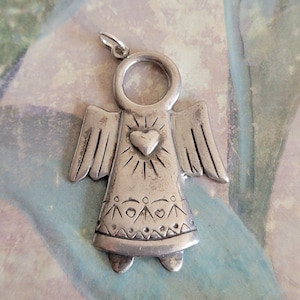 Vintage Sterling Silver Angel with a Heart Pendant