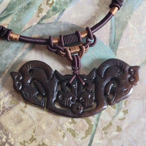 Vintage Carved Dyed Soapstone Horse Heads Pendant on a Brown Cord Jade Bead Closure