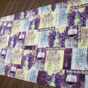 purple and yellow wine print with grapes and vines on light yellow print reversible table runner table decor table topper