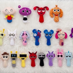 May include: A collection of thirty-two small, colorful plush toys arranged in three rows. Each toy features a unique character design with various shapes, facial expressions, and vibrant colors including red, blue, green, yellow, purple, and orange.