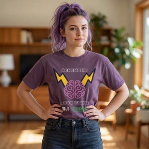 May include: A white ceramic mug with a black handle and the text "But First, Coffee" in a bold, black font. The mug is set against a blurred background, suggesting a cozy setting.