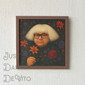 May include: A framed portrait of a man with white hair and a black shirt, wearing glasses and holding a flower. The background is a dark floral pattern with red, orange, and purple flowers.