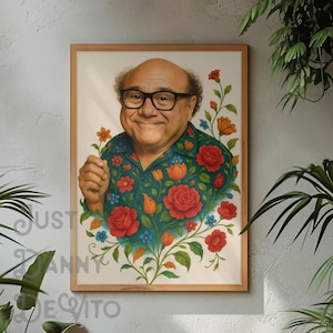 May include: A framed portrait of a man with a mustache and glasses, wearing a green shirt with red, orange, and blue flowers. The background is white.