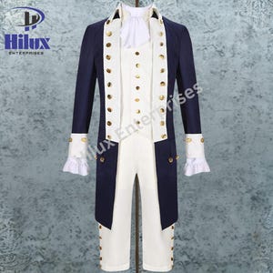 May include: A navy blue and white historical costume. The long coat has gold buttons and white cuffs with ruffles. The white vest and trousers have gold buttons. The costume is displayed on a mannequin.