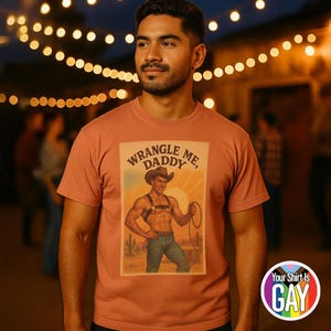 Gay Cowboy Shirt &quot;Wrangle Me Daddy&quot; Vintage Style Rodeo Pride Tee With Leather Harness Cowboy And Queer Western Humor On Comfort Colors