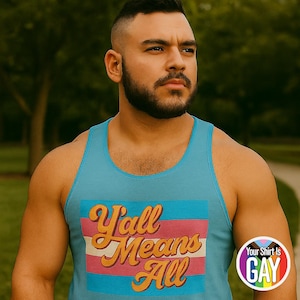 May include: A turquoise tank top with the text "Y'all Means All" in a retro font, above a pink, white, and blue striped design. A circular logo with the text "Your Shirt Is Gay" is on the bottom right.