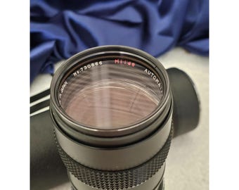 Lente automática Milda vintage n.º 730866 f/3.8 75-205 mm con estuche Fabricada en Japón