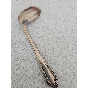 Vintage Silver-Plated Spoon with Ornate Handle Design 6 Inches Long Collectible