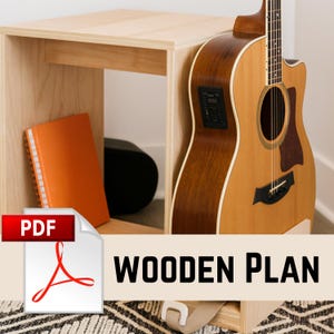May include: A light-colored wooden side table with a shelf, an orange notebook, and a black speaker. A brown acoustic guitar leans against the table. The image includes a PDF icon and the words "WOODEN PLAN".