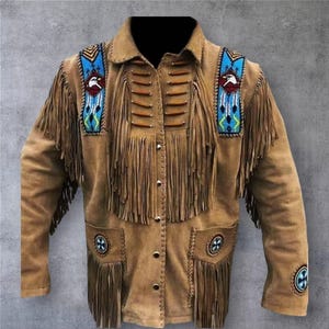 May include: A tan suede jacket with fringe detailing and decorative beadwork. The jacket features a button-up front, two front pockets, and embellishments on the shoulders and cuffs. The shoulder details include a blue and white beaded design with an eagle.
