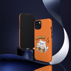 May include: Orange phone case featuring a cartoon white cat playing bongos, with the word "Bongo!" above the cat. A black phone is displayed next to the orange case. Musical notes and confetti are also included in the design.