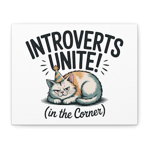 May include: A canvas print featuring a grumpy cat wearing a party hat. The text "INTROVERTS UNITE! (in the Corner)" is displayed above and below the cat illustration in bold, black font. The cat has orange and white fur.
