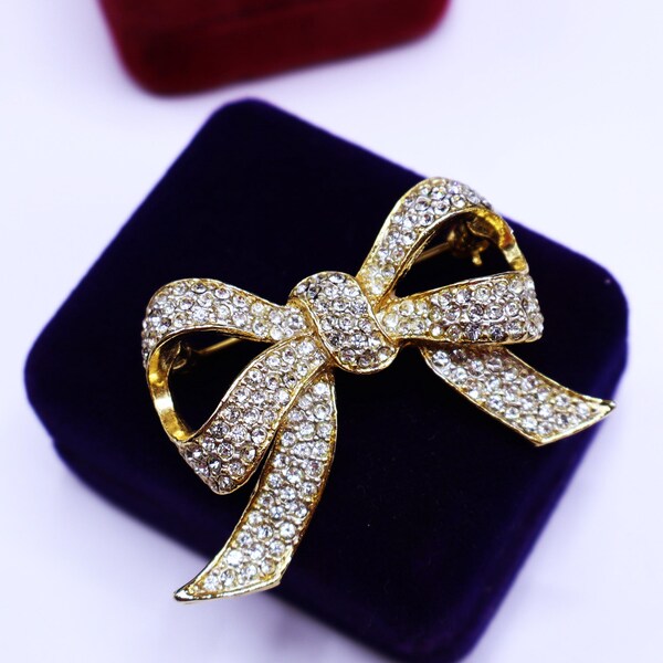 Vintage gold tone clear rhinestone bow pin brooch