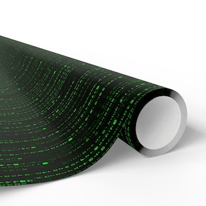 May include: A roll of black wrapping paper featuring a matrix-style pattern of green numbers and symbols. The paper is rolled, showing the white interior. The design is reminiscent of computer code.