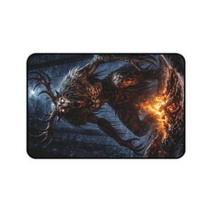 May include: Rectangular mousepad featuring a detailed illustration of a monstrous creature with antlers, glowing eyes, and fiery accents. The artwork is set against a dark, forested background, creating a fantasy theme.