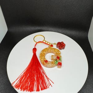 O conjunto de chaveiros mais chique - chaveiro elegante com borla e pingente de pata com design de letras para itens essenciais do dia a dia, resistente e durável
