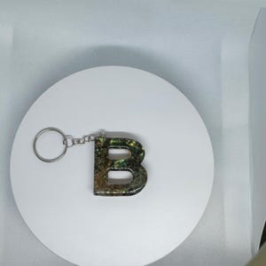 Chaveiro de resina com letras Forest Flame