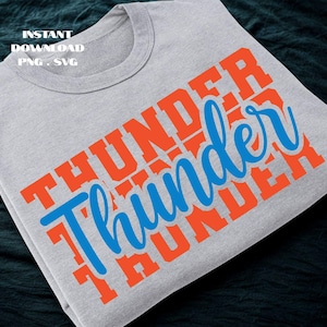 May include: A folded gray t-shirt with the word "THUNDER" in orange block letters and the word "Thunder" in blue cursive script. The shirt also has the text "INSTANT DOWNLOAD PNG . SVG".