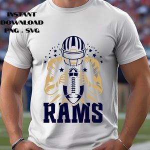 May include: White t-shirt featuring a football player graphic in gold and navy blue, holding a football. The word "RAMS" is printed in navy blue below the graphic. Text at the top reads "INSTANT DOWNLOAD PNG . SVG".