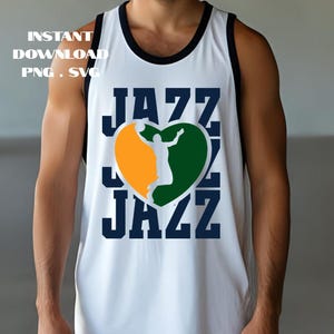 May include: White basketball jersey with black trim and the word "JAZZ" in navy blue. The jersey features a heart-shaped graphic with a basketball player silhouette in orange and green. Text at the top reads "INSTANT DOWNLOAD PNG . SVG".