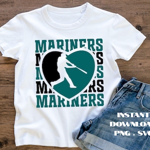 May include: White t-shirt featuring the word "MARINERS" in teal and black, surrounding a teal heart with a baseball player silhouette. The shirt is paired with denim shorts. The image also includes text that says "INSTANT DOWNLOAD PNG . SVG".