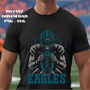 May include: Black t-shirt featuring a teal and gray graphic of an American football player holding a football. The word "EAGLES" is printed in teal below the graphic. The words "INSTANT DOWNLOAD PNG . SVG" are printed in white at the top.