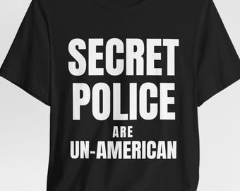 T-shirt en jersey unisexe activiste : résistez à la police secrète - Droits humains