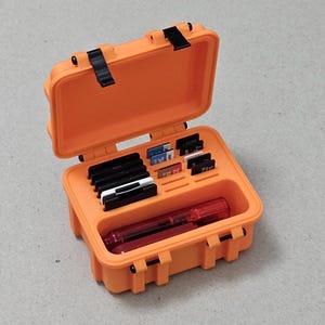 Handy rugged SD card storage box that locks closed! Stores 6 SD cards, 12 micro SD cards and 3 usb sticks.